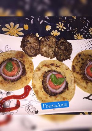 A picture of Coin Chapli kabab with Coin Paratha.