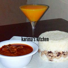 A picture of Rice and beans/dry fish stew.