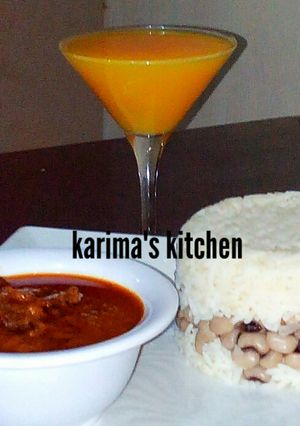 A picture of Rice and beans/dry fish stew.