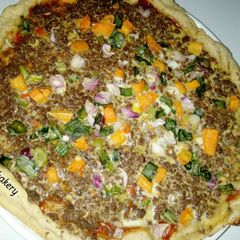 A picture of Cheeseless colourful pizza.