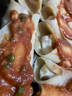 Una foto de Canelones relleno de jamón y queso