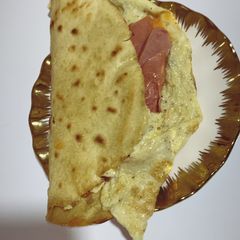 Tortilla and egg sausage wrap A picture of Tortilla and egg sausage wrap.