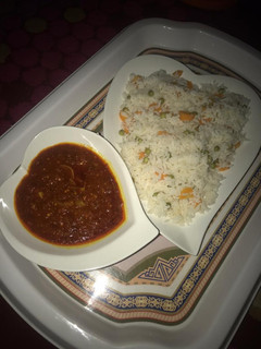 A picture of Carrot and green beans rice with stew.