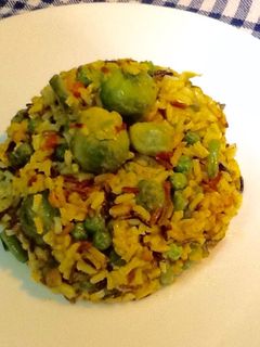 Una foto de Flan de arroz largo y salvaje con menestra al Ras El Hanout