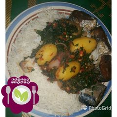 A picture of Rice and ugu leaf.