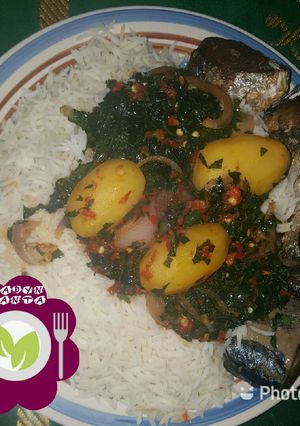 A picture of Rice and ugu leaf.