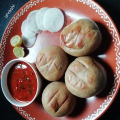 A picture of Masoor dal and bati.