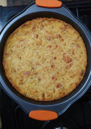 Una foto de Faina con cebolla y panceta