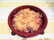 Una foto de coliflor morada con bechamel