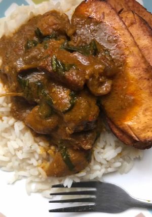A picture of Banga Stew with White Rice and Plantain.