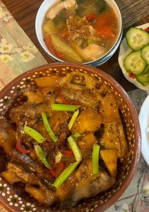 A picture of Vietnamese Sweet and Sour Soup (Canh Chua) and Braised Catfish (Ca Bong Lau Kho To).