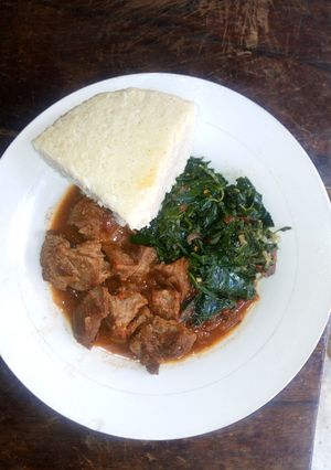 A picture of Beef stew Ugali and Cowpeasleaves.