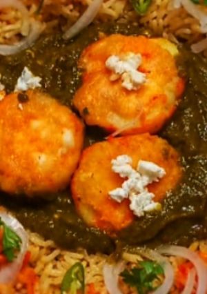 A picture of Palak Aloo with onion Rice.