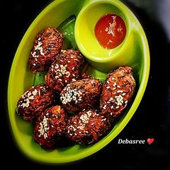 A picture of Red amaranth Pakora with Sesame Seeds.