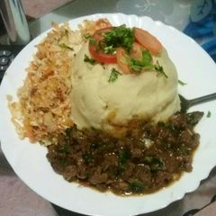 A picture of Mashed potatoes with beef fry.