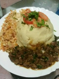 A picture of Mashed potatoes with beef fry.