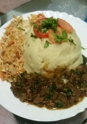 A picture of Mashed potatoes with beef fry.
