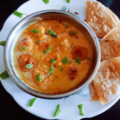 A picture of Tasty masaledar Kadhi pakoda with phulka roti for Gujarati dinner.