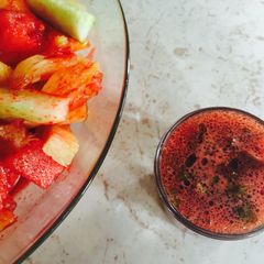 A picture of Beet Vinaigrette drizzled over a Pineapple, Watermelon and Cucumber Salad.