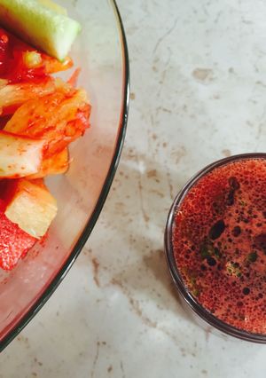 A picture of Beet Vinaigrette drizzled over a Pineapple, Watermelon and Cucumber Salad.