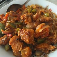 A picture of Stir fry chicken masala with vegetables.