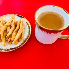 A picture of Ginger Milk Tea ☕️ with Savory Twisty😋.