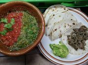 Una foto de milanesas de carne con harina