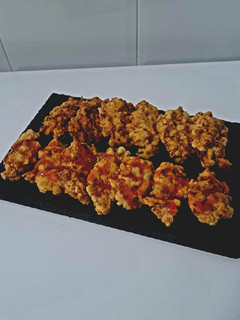 Una foto de Coliflor rebozada con salsa thai
