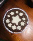 Pastel de vainilla cubierto con chocolate y coco