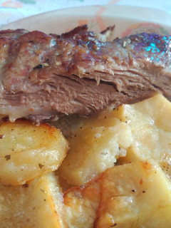 Una foto de Presa ibérica con patatas y un toque de miel al horno