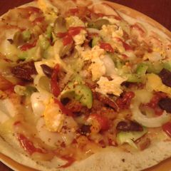 A picture of Pizza on Labanese bread with Potato.