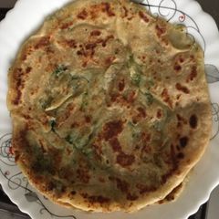A picture of Aalo matar paratha.