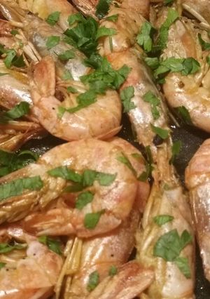 A picture of King prawns in a brandy and lemon sauce.