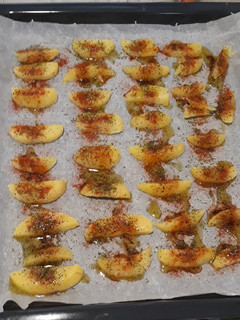 Una foto de Patatas especiadas fritas en el horno