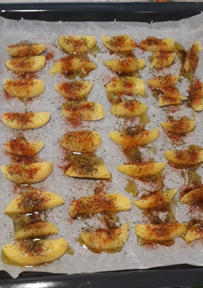 Una foto de Patatas especiadas fritas en el horno