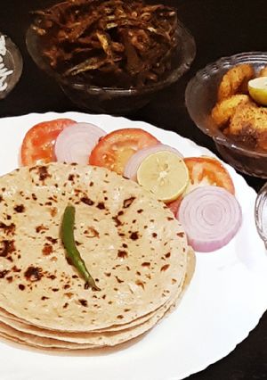 A picture of Tawa roti, aloo tuk,karari bhindi,jeera rice, masoor dal,salad.