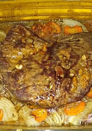 Una foto de Asado Carnicero al Horno en cama de Verduras