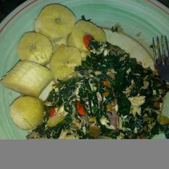 A picture of Unripe plantain and ugu sauce.