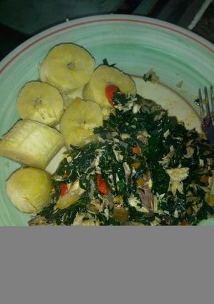 A picture of Unripe plantain and ugu sauce.