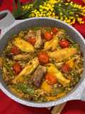 Paella de costillas de cerdo y alitas de pollo