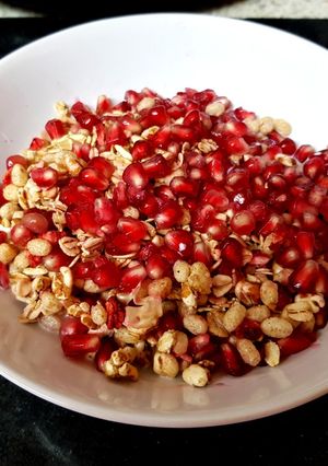 A picture of My Granola and pomegranate seeds Breakfast. 🙄.