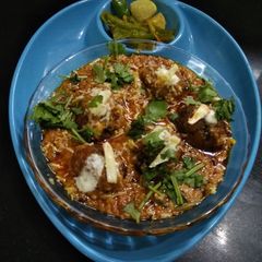 A picture of Khichdi dumplings in gravy.