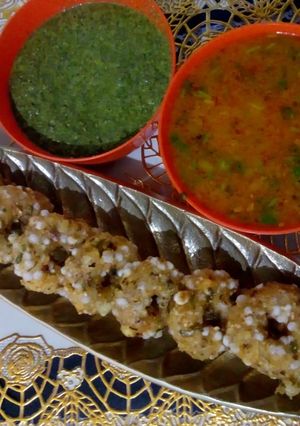 A picture of Sabudana vada with spicy gravy aloo.
