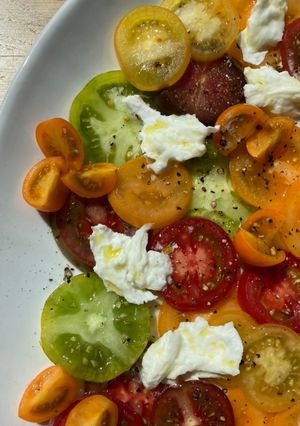 A picture of Heritage Tomato and mozzarella salad.