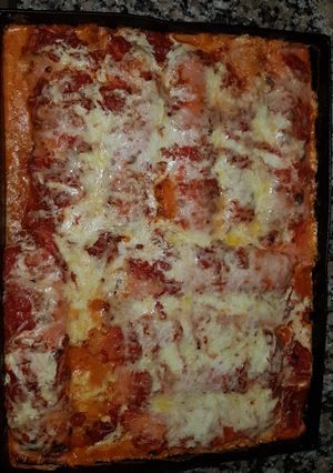 Una foto de Canelones rojos de espinaca y ricota