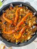 Arroz meloso de calamarchines, sepia y gamba roja