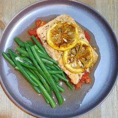 A picture of Roasted Salmon with Roasted Plum Tomatoes & Caramelized Lemons.