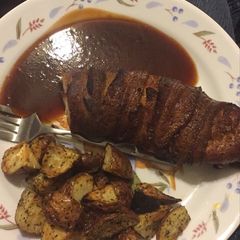 A picture of Smoked Bacon Wrapped Chicken Breast with Roasted Red Potatoes.