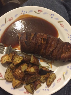 A picture of Smoked Bacon Wrapped Chicken Breast with Roasted Red Potatoes.