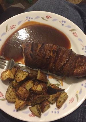 A picture of Smoked Bacon Wrapped Chicken Breast with Roasted Red Potatoes.
